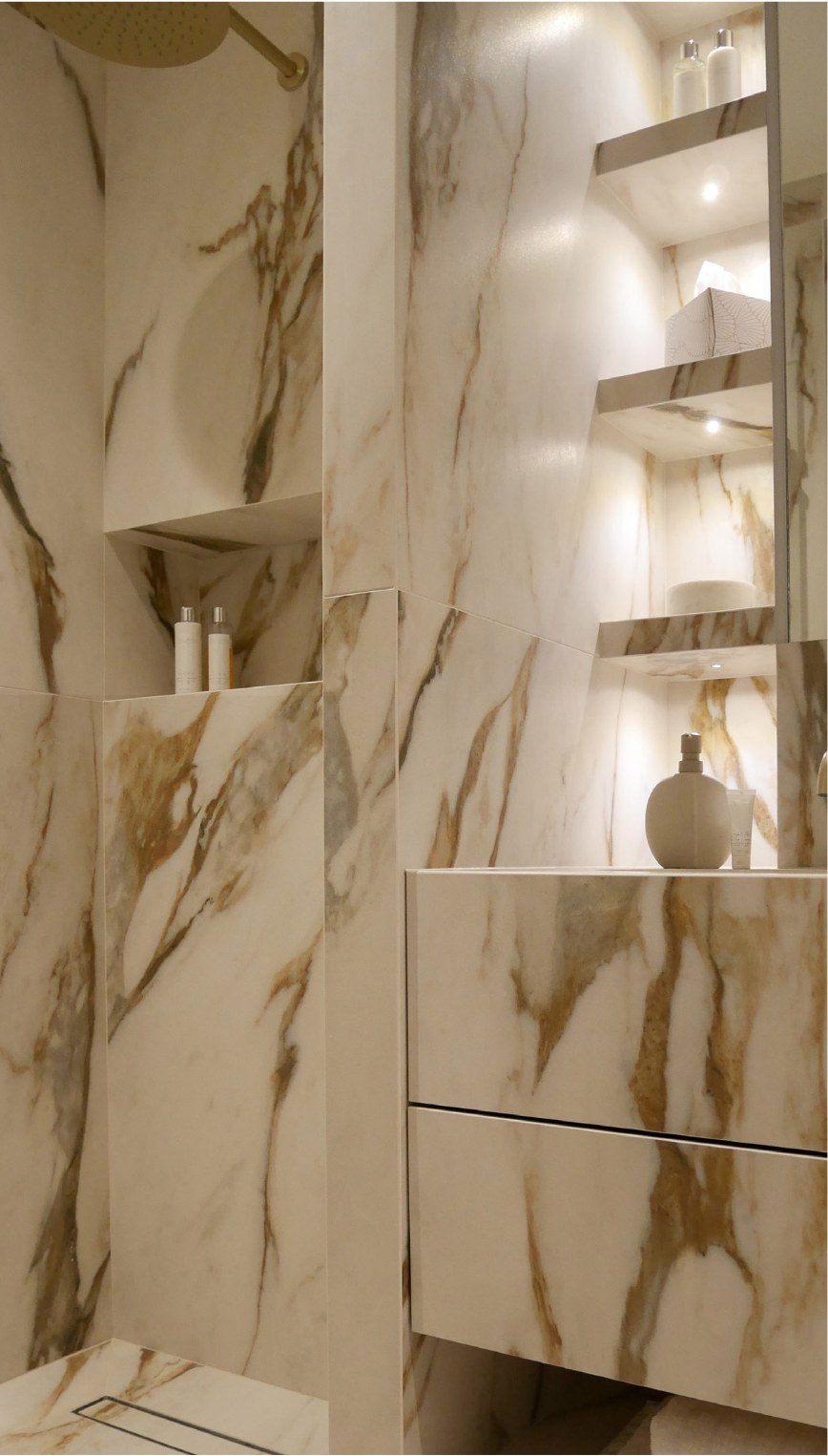 Marble-tiled bathroom in Hackney