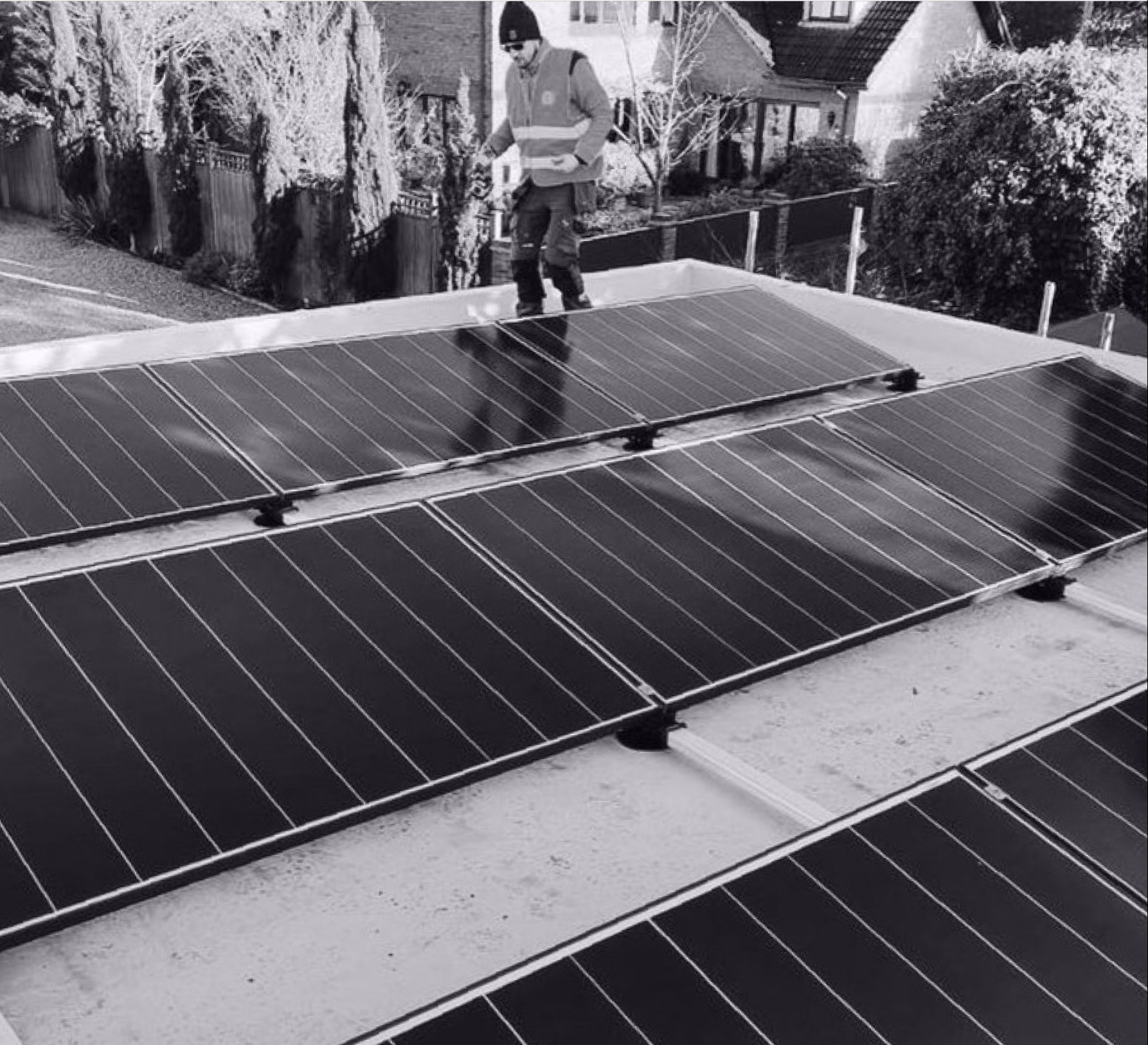 Solar panels being installed on a flat roof